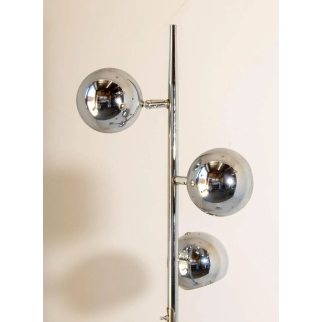 1970s Vintage chrome floor lamp with three pivoting "eyeball" globe shades. Vintage steel and chrome floor lamp featuring...