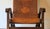 Angelo I Pazmino folding chair in teak and tooled leather, designed for Muebles de Estilo, Ecuador 1970s. The leather is...