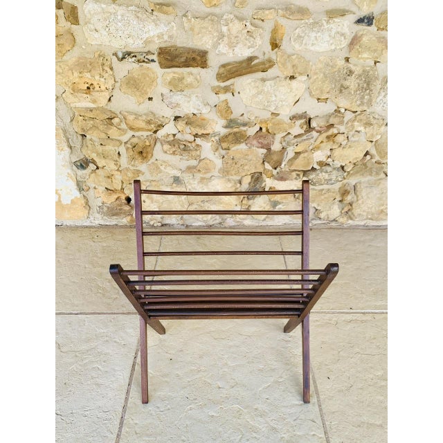 Mid-century, scandinavian-style, folding magazine rack made of walnut on tapered legs, designed in the style of cees...