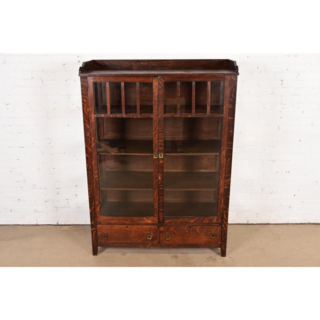 A beautiful antique Mission or Arts & Crafts period bookcase cabinet or display cabinet In the manner of Charles P....