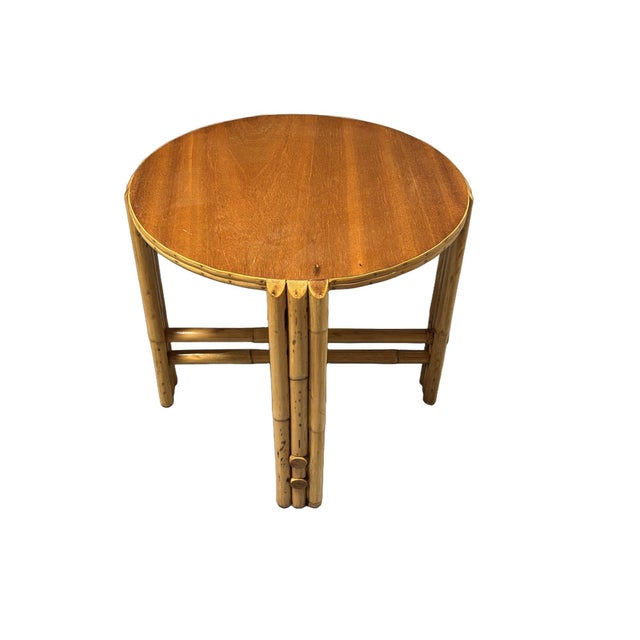 Small circular rattan side table with 21" round Mahogany top and decorative 3-strand vertically stacked legs. The table...