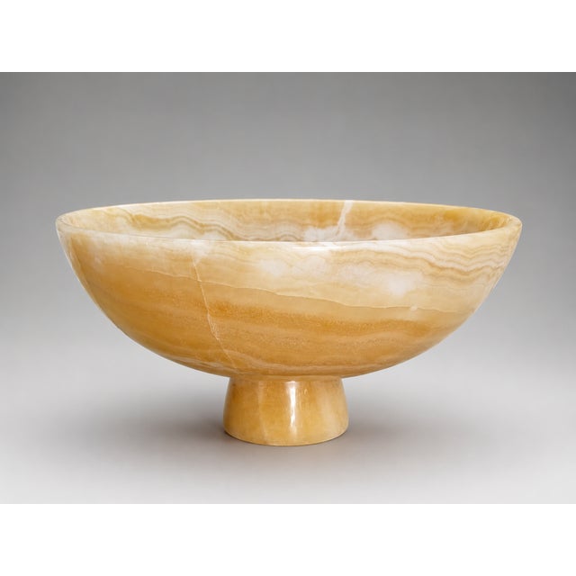 Bring timeless elegance to your home with this handcrafted Honey Onyx Pedestal Bowl. Expertly carved from genuine honey...