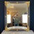 Large scale Empire gold gilt and ebony black mirror is a large statement piece. The giltwood finish is complemented by a...