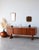 Beautility Teak Sideboard: The Icon of Vintage Design The Beautility teak sideboard instantly elevates your living room....