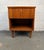 A classic mid-century modern walnut nightstand crafted by Young Manufacturing. Features clean lines, warm wood grain, and...