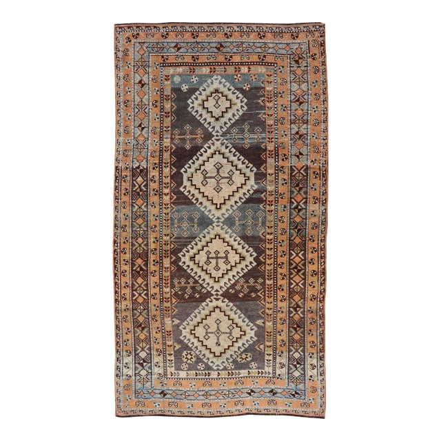 Antique Persian Lori Rug With All-Over Geometric Tribal Medallion Design 4'5 X 8'8 For Sale