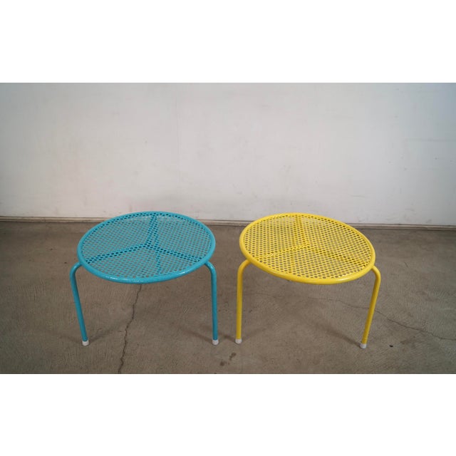 Pair of 1950's outdoor Mid century Modern end tables for sale. These are solid and well made, and are made of perforated...