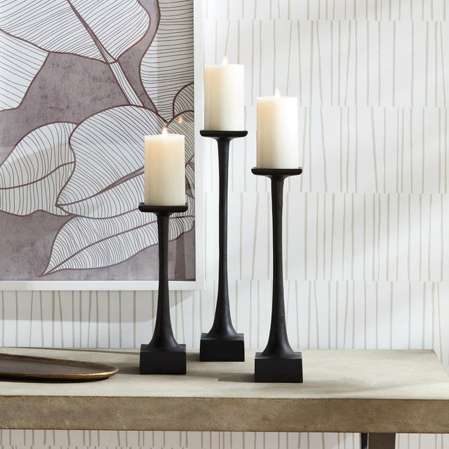 With a weighted base and tall slender body, this candle stand is a smart design. With classic lines, it plays well in the...