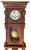 This is early 20th century wall pendulum clock; In a Mahogwith wooden case. Comes with winding key. Strikes the hour and...