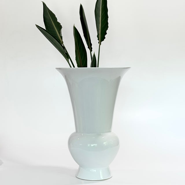 This piece is reminiscent of the iconic KPM Berlin "Fidibus" White Porcelain Vase, originally designed by the celebrated...