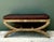 This vintage rattan and leather bench exemplifies a thoughtful balance of natural materials and timeless design, evoking...