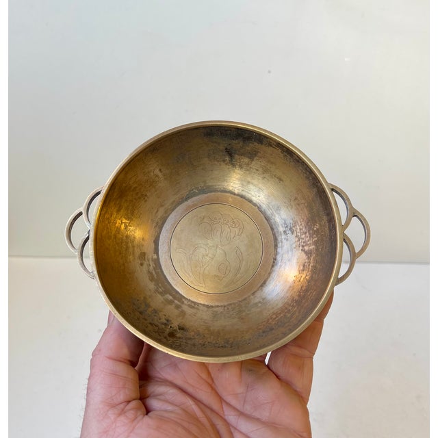 Small stylish dish executed in bronze and featuring the most gorgeous piercet wings/handles, an engraved center flower and...