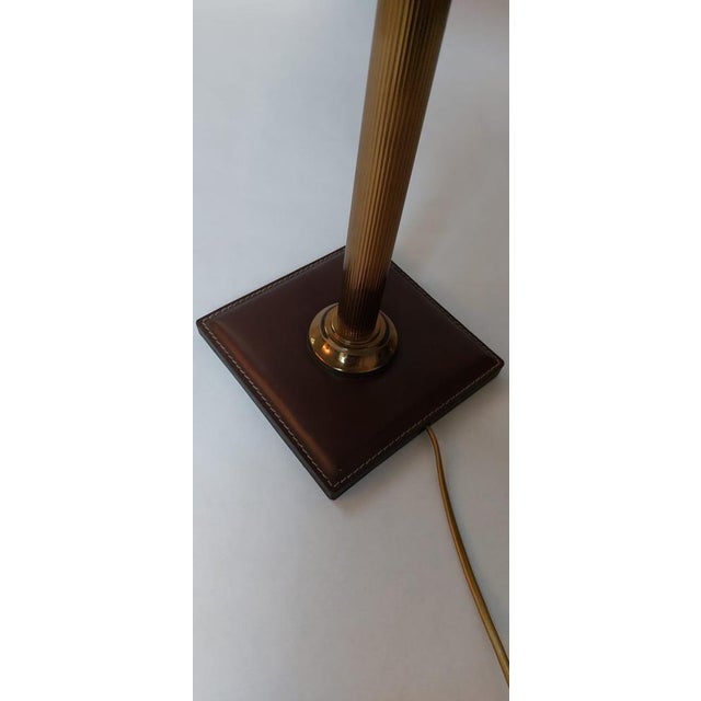 the metal part is in very good condition. the brown leather is as well in good condition. there is just a tiny piece of...