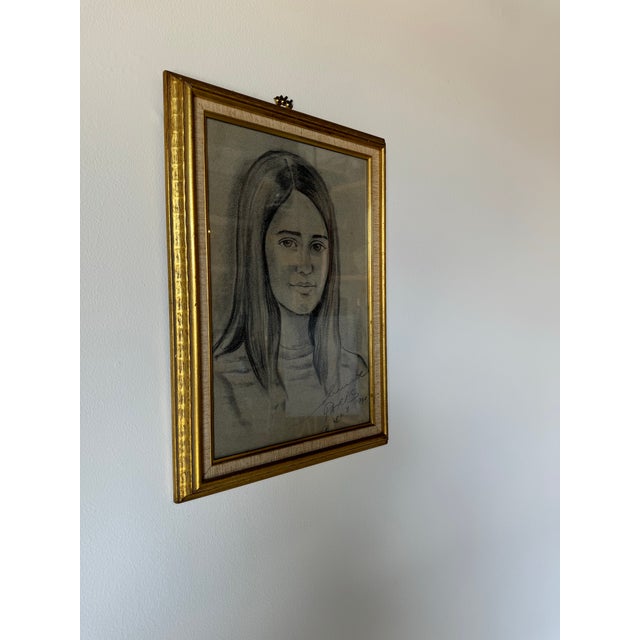 A fine Vintage charcoal and pencilon paper drawing portrait, it depicts a portrait of a young woman. Executed in 1980....