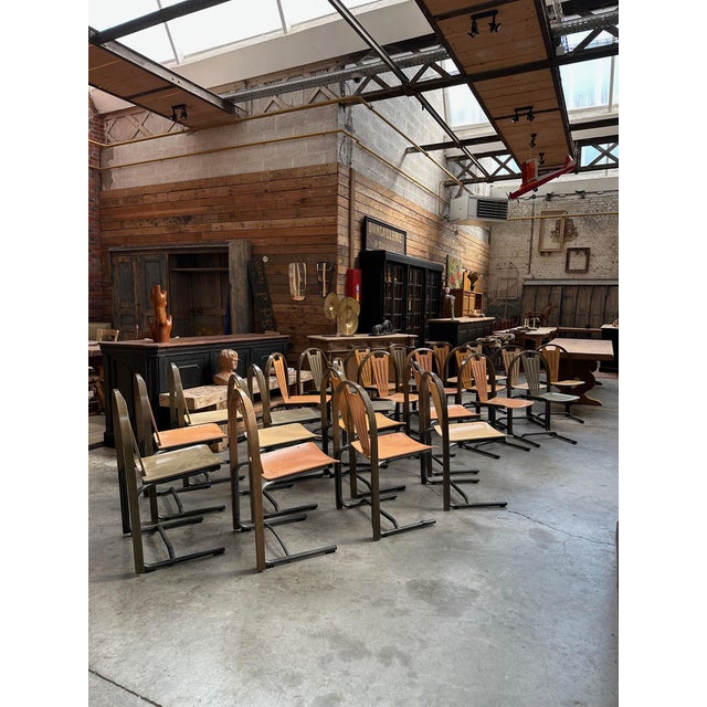 Series of 24 BAUMANN ARGOS chairs dating from the 80's Seat and back in curved beech, metal frame Nice patina of use, 4...