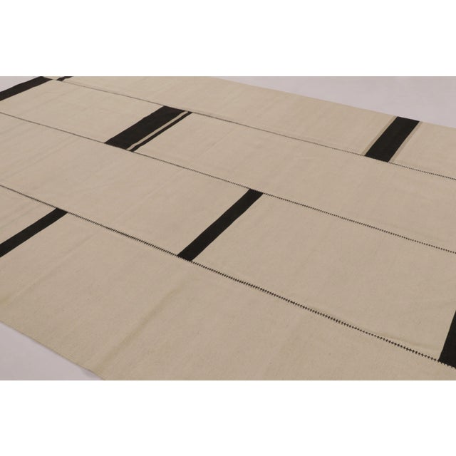 Handwoven in wool, this 9x12 contemporary Kilim is part of Rug & Kilim’s “Rez Kilim” collection, an innovative take on...