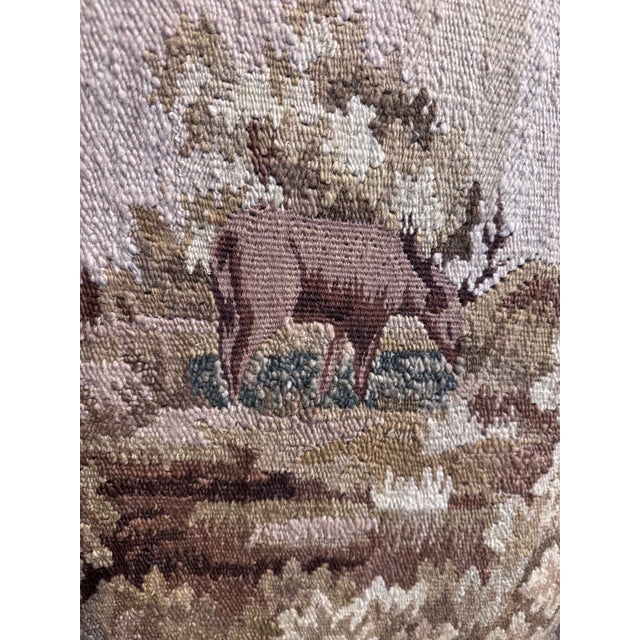 A beautifully made EuroAntique English manor style armchair featuring a tall upholstered back, gracefully scrolled arms,...