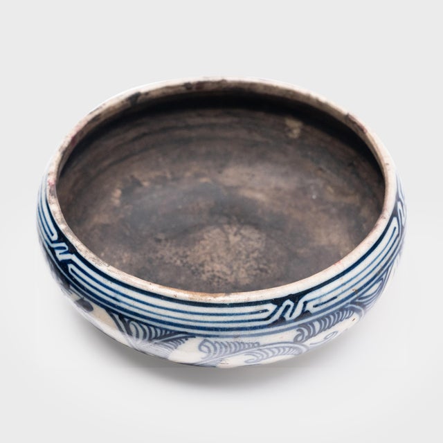 This antique Chinese basin dates to the early 19th century and is beautifully hand-painted in the blue-and-white manner....