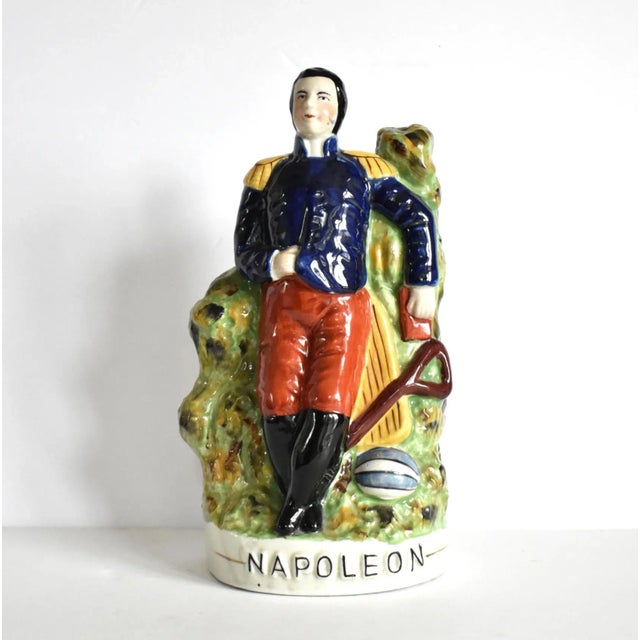 An antique, 19th-century Staffordshire ceramic figurine or statuette of Napoleon Bonaparte