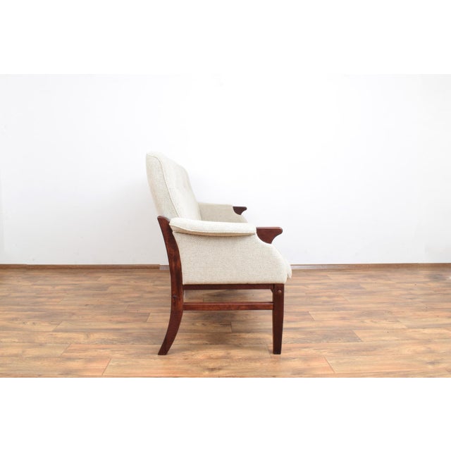 This sofa made in Denmark in the 70's. It is preserved in its original, very good condition. Wooden elements are made of...