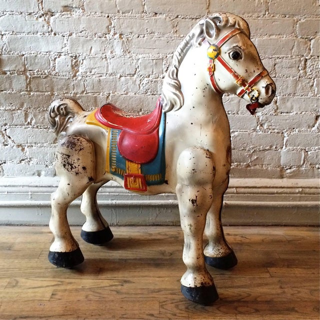 Vintage, 1940s, painted, pressed steel hobby horse manufactured by Mobo Toys, England with casters on feet and excellent...
