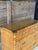 Late 20th-century rattan-wrapped campaign chest crafted in the style of Bielecky Brothers. This large and impressive...