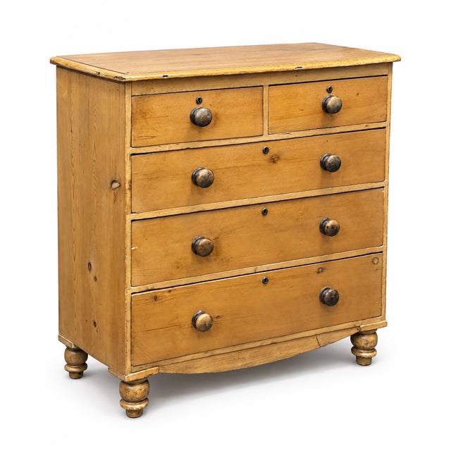 A handsome 19th-century English pine chest of drawers dating to the Victorian period, circa 1860–1880. Constructed in...