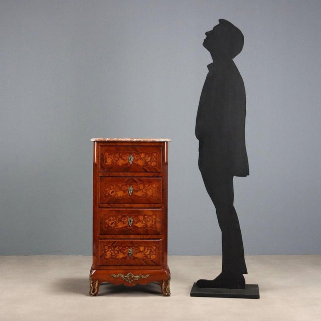 Napoleon III chest of drawers in Indian rosewood and violet wood, with maple trim and inlays. The front features four...