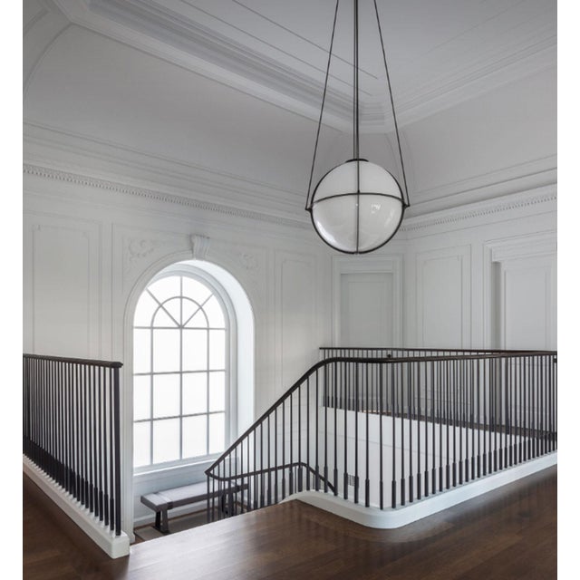 Elevate your space with the award-winning Boyd Globe Chandelier in Black, exclusively at circa20c. Winner of the ADEX...