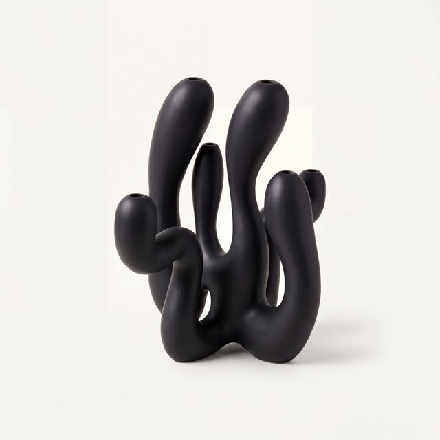 Includes: 6 taper candles, matchbox, glove set + signed COA An exploration of balance between strength and softness, Hold...