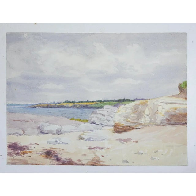 Vintage early 20th century french watercolor on paper painting of a rocky coastal beach scene. Unsigned. Unframed.