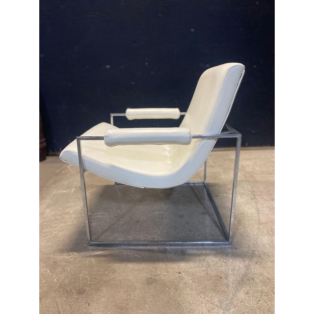 A lovely white vinyl scoop chair designed by Milo Baughman & produced by Thayer Coggin in the 70's. an excellent example.