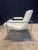 A lovely white vinyl scoop chair designed by Milo Baughman & produced by Thayer Coggin in the 70's. an excellent example.