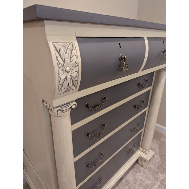 This beautiful antique chest of drawers has two over four drawers, new antique-style hardware, and a painted antique...