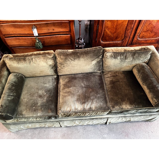 A quintessential example of high-quality American craftsmanship, this piece is upholstered in a plush, moss green velvet...