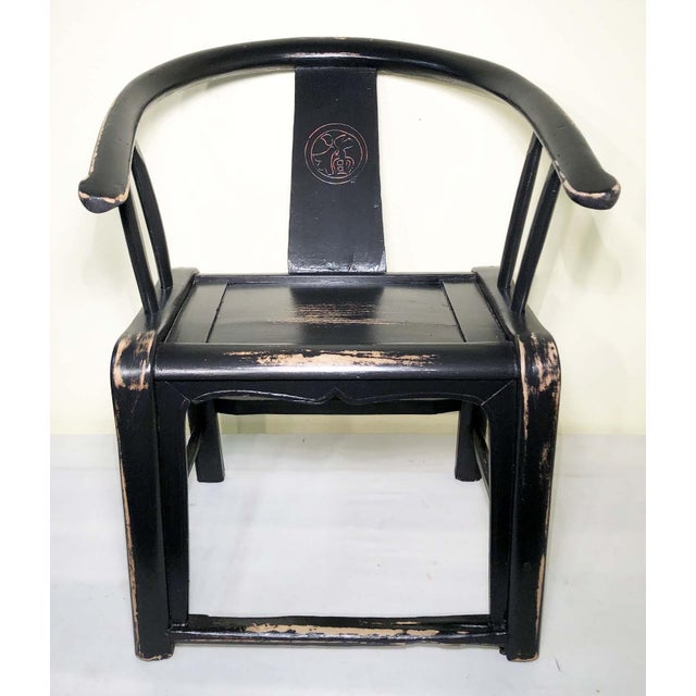 This early 19th-century antique Chinese armchair, crafted in the Ming style, features a "happiness" design on the back...