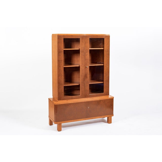 This vintage antique Art Deco figured, two-tone wood cabinet likely of English origin is circa 1930. The cabinet is...