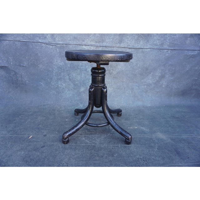 Embossed, or stamped, art nouveau design on the seat. Thonet marque is impressed on the wood. Measures 15 3/4" x 15 3/4" x...