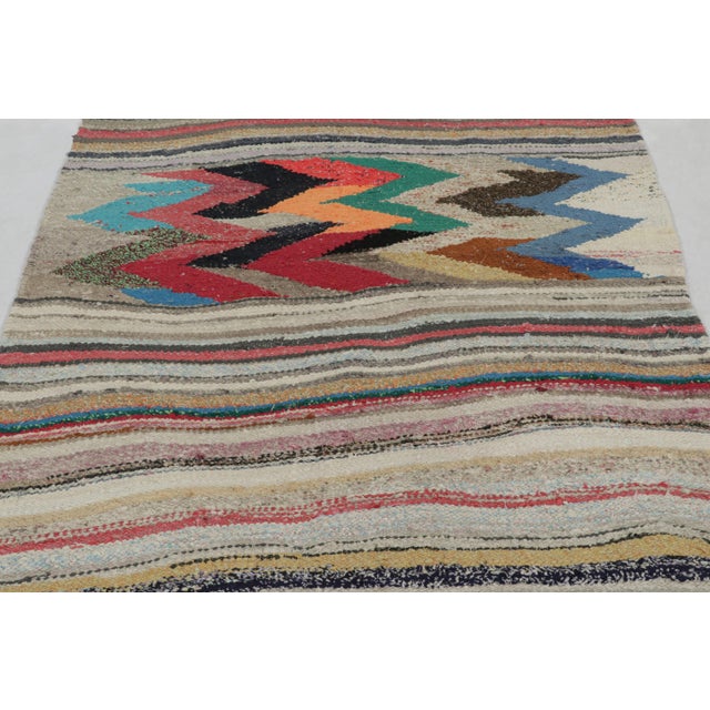 Handwoven in wool by nomads of the Shahson clan circa 1950-1960, this 5x8 vintage Persian Kilim is a particularly bright...