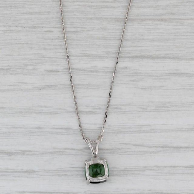 Gemstone Information: - Natural Tourmaline - Carats - 1.60ct Cut - Cushion Color - Green - Natural Diamonds - Small single...