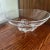 This vintage Steuben three footed crystal bowl is a stunning piece of mid-century modern art glass. The round bowl...