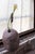The sitter purple granite found flower vessel by studio do dimensions: d 17 x w 9 x h 35 cm materials: stainless steel,...