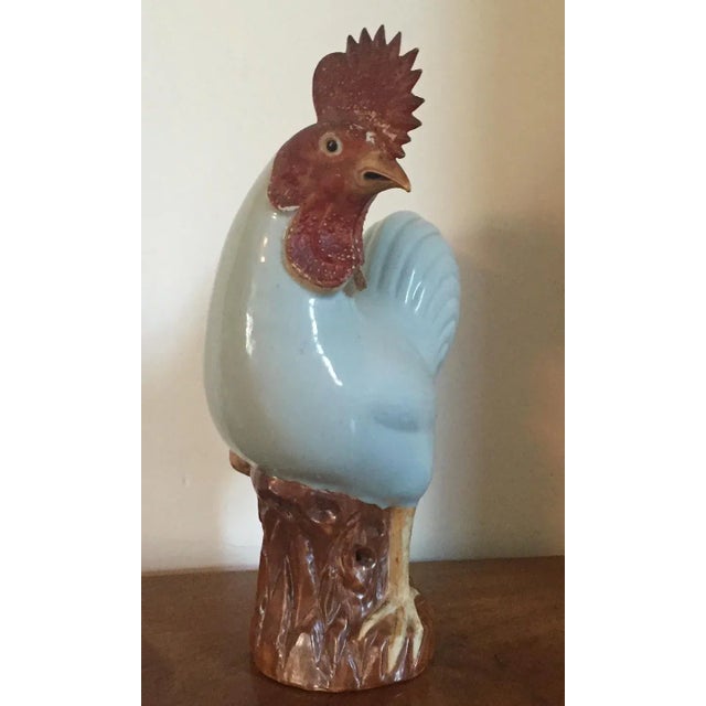 Antique 18th c. Chinese porcelain chicken standing atop pierced rockwork. Relief detail highlights the feathers. The comb...