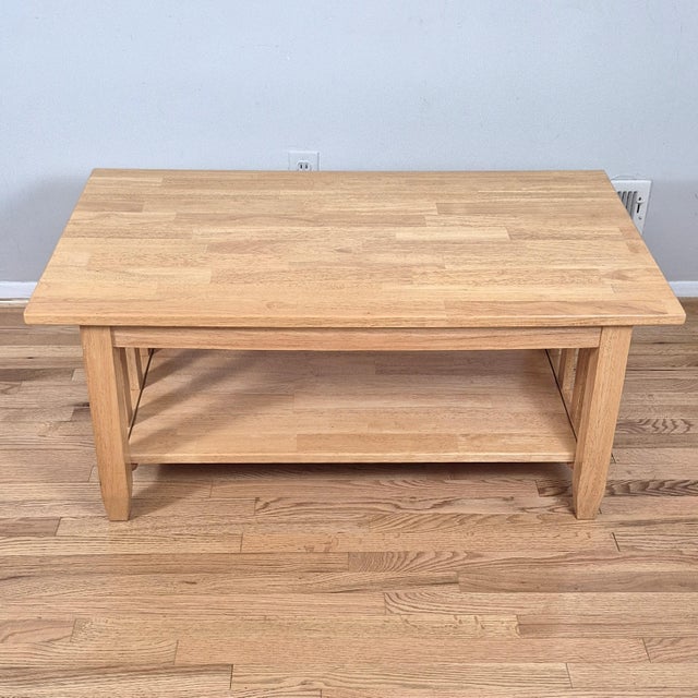 This is a solid oak rectangular coffee table in a streamlined mission or arts & crafts style. The coffee table is made of...