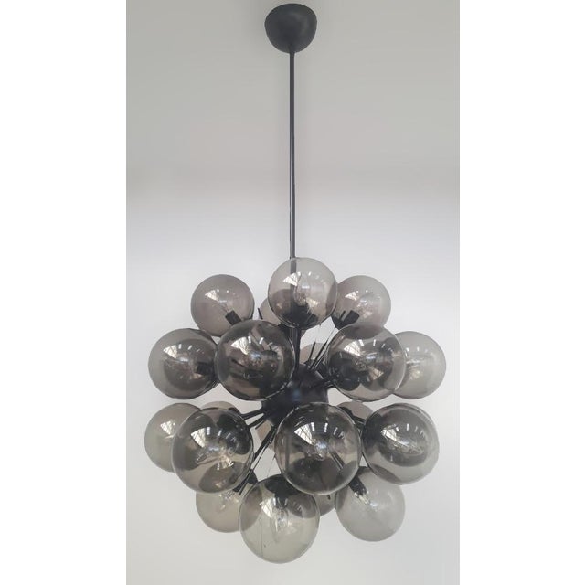 Italian sputnik chandelier with 24 smoky Murano glass globes mounted on black powder coat finish frame / Made in Italy 24...