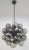 Italian sputnik chandelier with 24 smoky Murano glass globes mounted on black powder coat finish frame / Made in Italy 24...