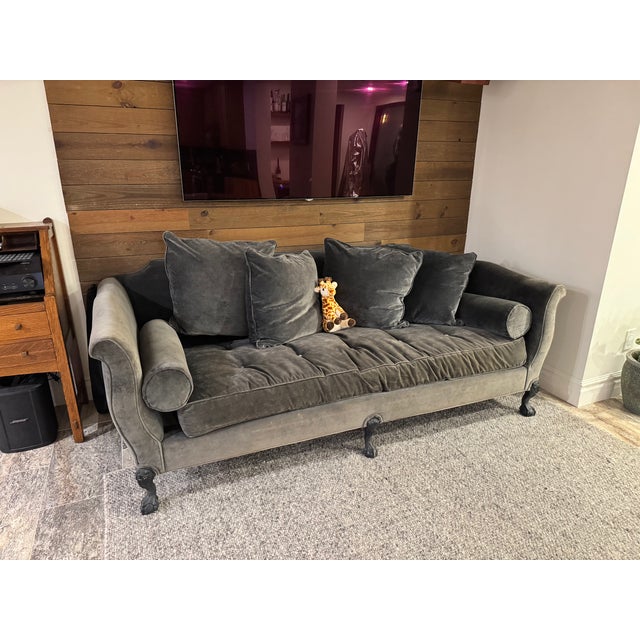 A French Louis XV–style sofa that carries the full vocabulary of the period: out-scrolled arms, a gently serpentine back,...