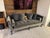 A French Louis XV–style sofa that carries the full vocabulary of the period: out-scrolled arms, a gently serpentine back,...
