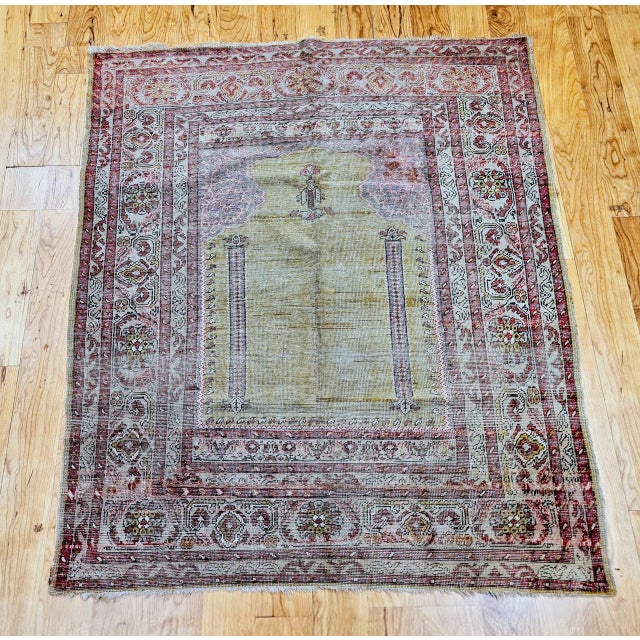 An exceptional late 19th century Anatolian Turkish village rug in the traditional prayer Mihrab design, masterfully...