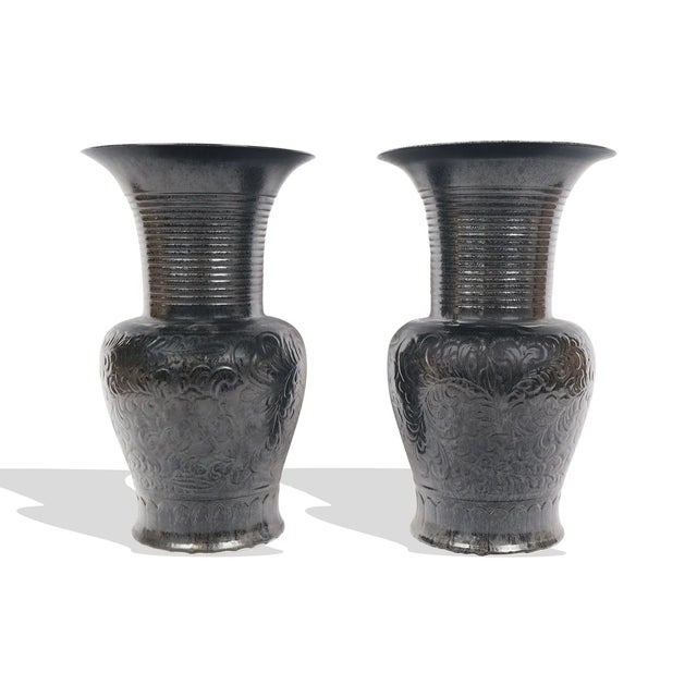 An impressive pair of large-scale Chinese black glazed porcelain vases dating to the late 20th century. Each vase features...
